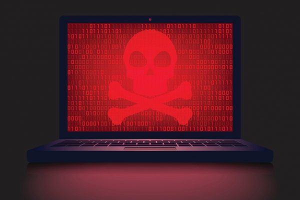skull on laptop displaying a ransomware cyber attack virus